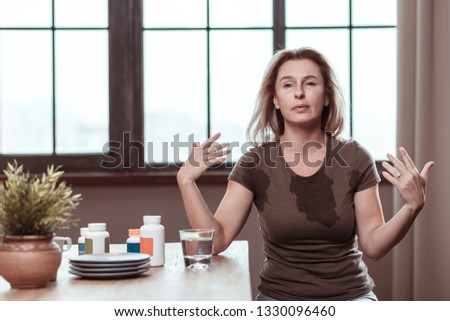 Having panic attack. Dark-eyed depressed woman having panic attack after taking too many pills