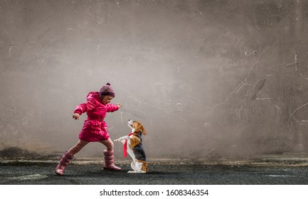 Having winter fun with pet friend - Shutterstock ID 1608346354