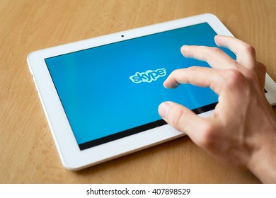 HAVIROV, CZECH REPUBLIC - APRIL 18, 2016: Man's Hand Use With His Fingers Tablet. Skype App Is On The Screen. Skype Provides Video Chat And Voice Call Service. (shallow Selective Focus)