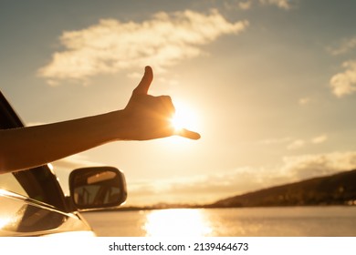 Hawaii Beach Holiday Road Trip. Shaka Hand Sign At Sunset.