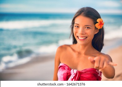 Hawaii Hula Dancer Asian Woman On Luau Party On Hawaiian Beach Doing Shaka Hand Sign. ALOHA Spirit.