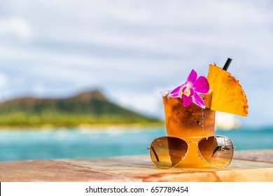 Hawaii Mai Tai Cocktail Drink On Waikiki Beach Bar With Flower, Pineapple And Sunglasses. View Of The Ocean And Diamond Head Mountain In Honolulu, Hawaii. Summer Vacation.