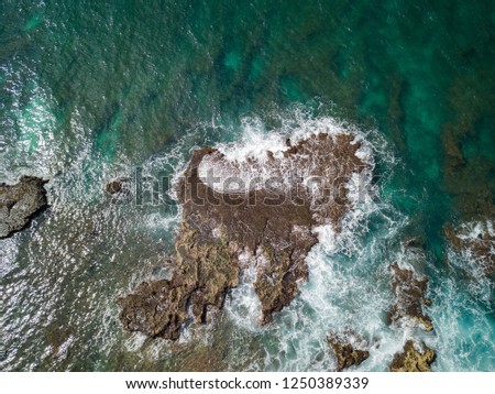 Similar – Aerial Drone View Of Dramatic Ocean Waves Crushing On Rocky Landscape