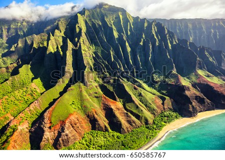 Hawaii nature travel destination. Na Pali coast on Kauai island. Helicopter aerial view of Na Pali Coast mountain landscape in Kauai island, Hawaii, USA.