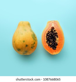 Hawaii Papaya On A Pastel Blue Background, Creative Food Concept, Tropical Fruit Flat Lay