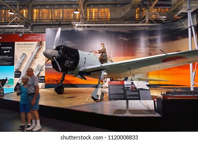 Hawaii, USA-March 16, 2017: Zero Battle Displayed At Pacific Aviation Museum In Pearl Harbor, Hawaii, Tourists Taking A Commemorative Photo In Front Of It.