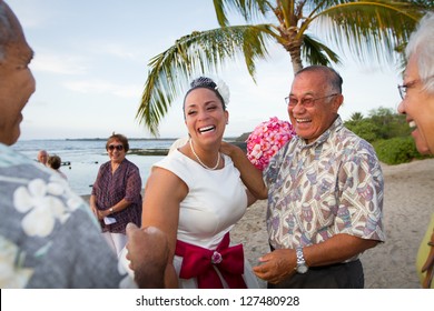 Hawaiian Beach Bride Laughing It Up With Friends And Family.