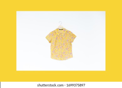 Hawaiian Blouse Is Clothes Hanger On White Background.