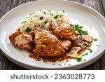 Hawaiian chicken style - shoyu chicken thighs with white rice on wooden table 