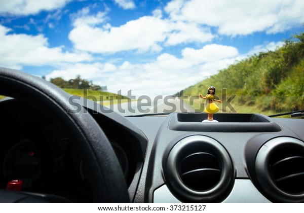 Hawaiian dancer doll in the
car panel 