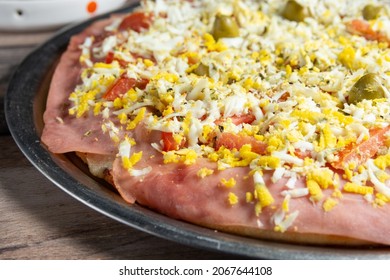 
Hawaiian Pizza With Egg Ham Tomato Cheeses And Olives