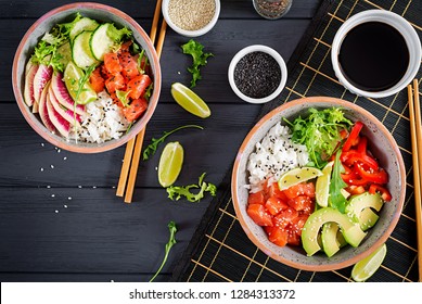 Hawaiian Salmon Fish Poke Bowl With Rice, Avocado, Paprika, Cucumber, Radish, Sesame Seeds And Lime. Buddha Bowl. Diet Food. Top View