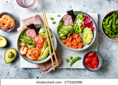 Hawaiian Salmon And Shrimp Poke Bowl With Seaweed, Avocado, Watermelon Radish, Edamame And Cucumber. Top View, Overhead