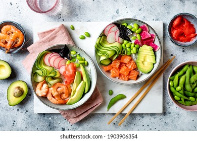 Hawaiian Salmon And Shrimp Poke Bowl With Seaweed, Avocado, Watermelon Radish, Edamame And Cucumber. Top View, Overhead