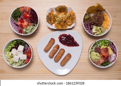 Hawaiian Salmon, Tuna And Shrimp Poke Bowls With Seaweed, Avocado, Mango, Pickled Ginger,queso Feta, Tequenos And Patacon. Top View, Overhead, 