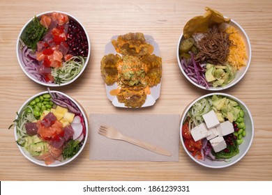 Hawaiian Salmon, Tuna And Shrimp Poke Bowls With Seaweed, Avocado, Mango, Pickled Ginger,queso Feta And Patacon. Top View, Overhead, 