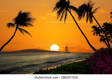 Hawaiian sunset with sailboat and mountains