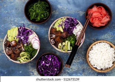 Hawaiian Tuna Poke Bowl With Seaweed, Avocado, Red Cabbage Slaw, Radishes And Black Sesame Seeds. Top View, Overhead, Flat Lay