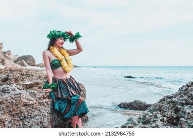 Hawaiian Woman Smiles Relaxed On A Paradise Beach. Exotic Beauty With Flower Crown On Her Head. Hula Dancer Costume.