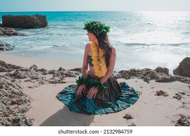 Hawaiian Woman Smiles Relaxed On A Paradise Beach. Exotic Beauty With Flower Crown On Her Head.