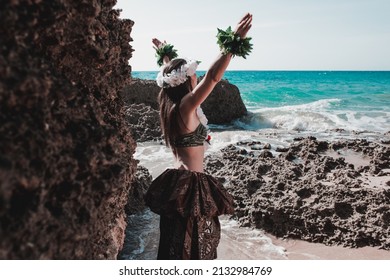 Hawaiian Woman Smiles Relaxed On A Paradise Beach. Exotic Beauty With Flower Crown On Her Head. Hula Dancer Costume.