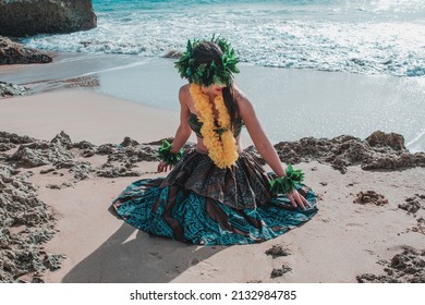 Hawaiian Woman Smiles Relaxed On A Paradise Beach. Exotic Beauty With Flower Crown On Her Head. Hula Dancer Costume.