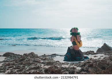 Hawaiian Woman Smiles Relaxed On A Paradise Beach. Exotic Beauty With Flower Crown On Her Head.