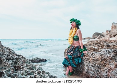 Hawaiian Woman Smiles Relaxed On A Paradise Beach. Exotic Beauty With Flower Crown On Her Head.