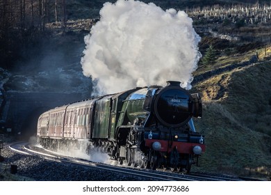 Hawes, England - 12 18 2021:LNER A3, , 60103, Flying Scotsman Catches The Winter Sun As She Steams Away From Blea Moor Tunnel Enroute To Carlisle.