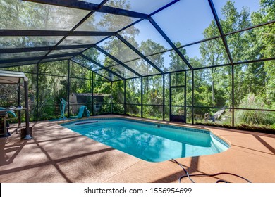 Hawthorne, Florida / USA - November 11 2019: Pool home with a clear blue sky - Shutterstock ID 1556954699