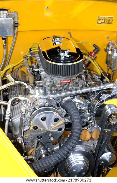 Hawthorne, NJ, USA - August 21, 2022:\
A customized, high-performance V8 engine in a 1941 Willy\'s coupe\
street rod on display at a small-town car show in New\
Jersey.