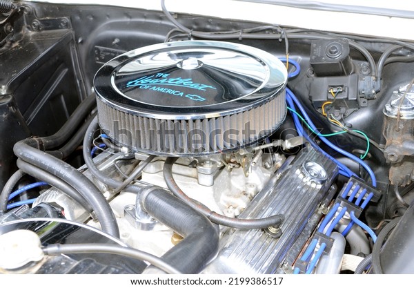Hawthorne, NJ, USA - August 21, 2022: A\
customized, high-performance V8 engine in a 1967 Chevy II on\
display at a small-town car show in New\
Jersey.