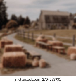 Hay bale seating lines a path to a weathered barn