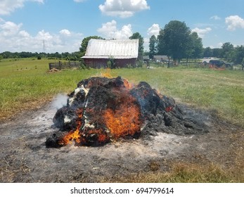 Hay Bales On Fire In Field With Heat Signature Obscuring Barn In Background 