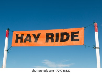 A Hay Ride Sign At A Pumpkin Patch In The Fall Season. 