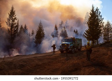 Hayfork, California -November 2020:  A Water Tender And Its Crew Walk The Line Of A Burning Operation On The August Complex Fire.