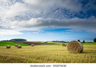 Haystack On A Field Of Stubble. August Countryside Landscape. Masuria, Poland.