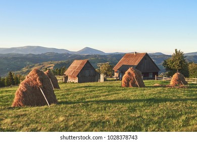 Haystack On Sunset. Meadow, Piece Of Grassland, Especially One Used For Hay. Carpathian Mountains, Ukraine.