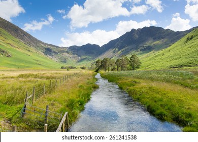 Haystacks Mountain Buttermere Lake District Cumbria Uk From Peggys Bridge In Summer With Blue Sky