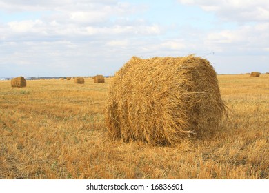 Haystacks on a background of the blue sky