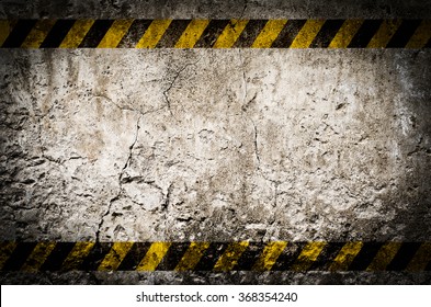 Hazard Tape On Blank Dirty Wall Background With Grunge And Vignette Tone