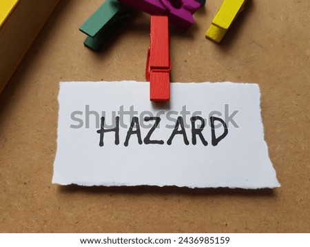 Hazard writting on table background.