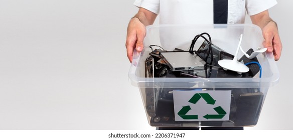 Hazardous E-Waste Recycling. Household electrical and scrapped electronic devices in recycle box. Sorting, disposing and recycling. Waste Electrical and Electronic Equipment. banner with copy space - Shutterstock ID 2206371947