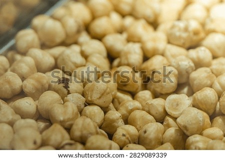 Hazelnuts forming a close-up background, presenting a healthy and organic snack option for baking, cooking, or enjoying as a nutritious ingredient