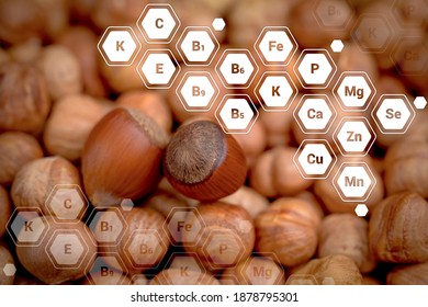 Hazelnuts With Letter Designations Of Vitamins And Minerals. Healthy Food Concept.