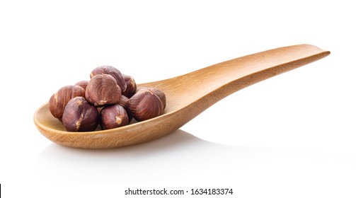 Hazelnuts In Wood Spoon  Isolated On White Background