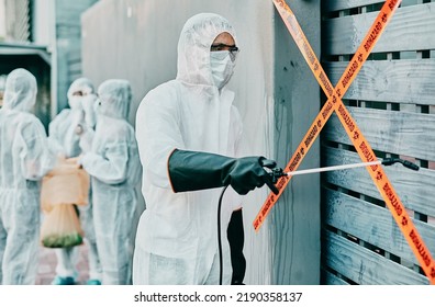 Hazmat wearing medical and healthcare worker sanitizing and cleaning a quarantine and contamination site. Medical professional stopping the spread of a virus or infection of a building in the city - Shutterstock ID 2190358137