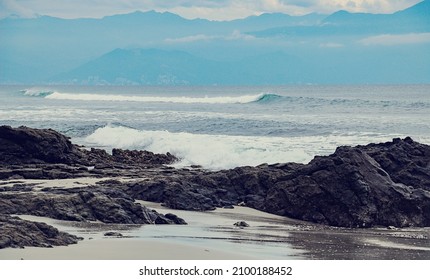 Hazy Day On The Rocky Beach