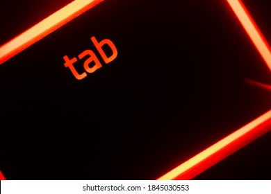 Hazy Red Illuminated Keyboard Tab Key Closeup