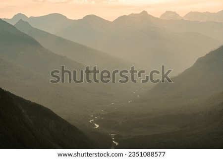Hazy Skies Over the McDonald River in Glacier National Park